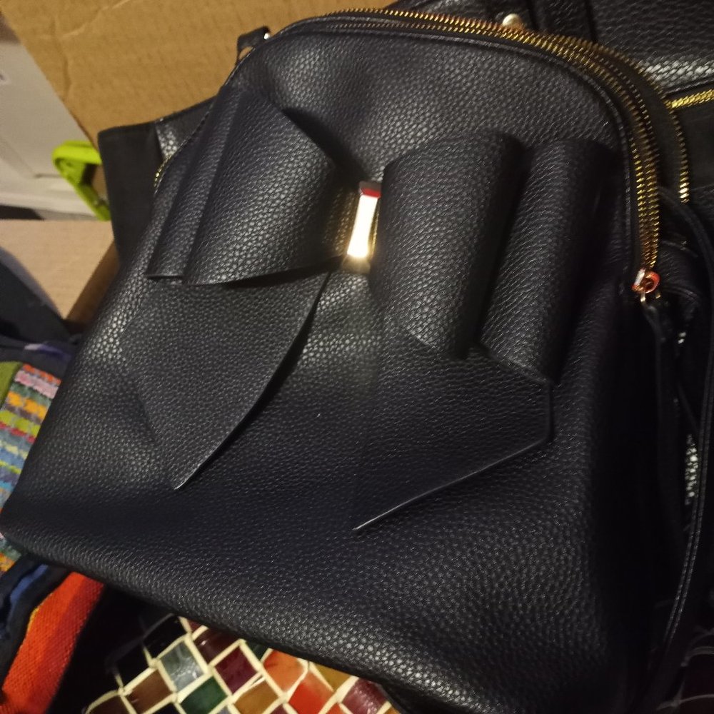 Cute bow backpack with gold accent